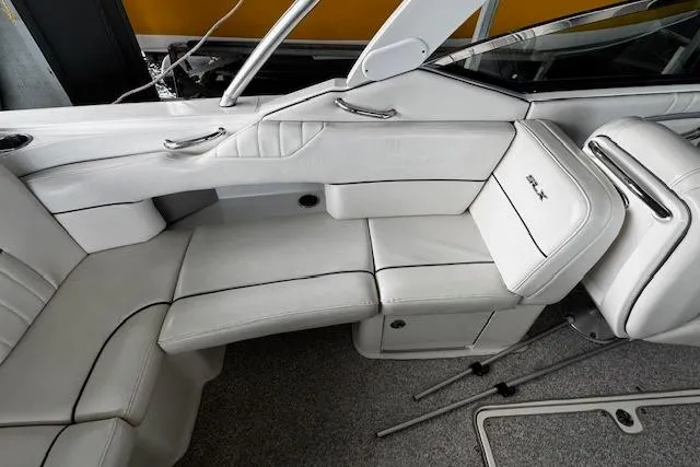 Slide: The Image of 2007 Sea Ray 270 SLX boat interior with white leather seating and sleek design. - 27