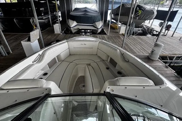 Slide: The Image of 2007 Sea Ray 270 SLX boat interior with spacious seating at a dock. - 29