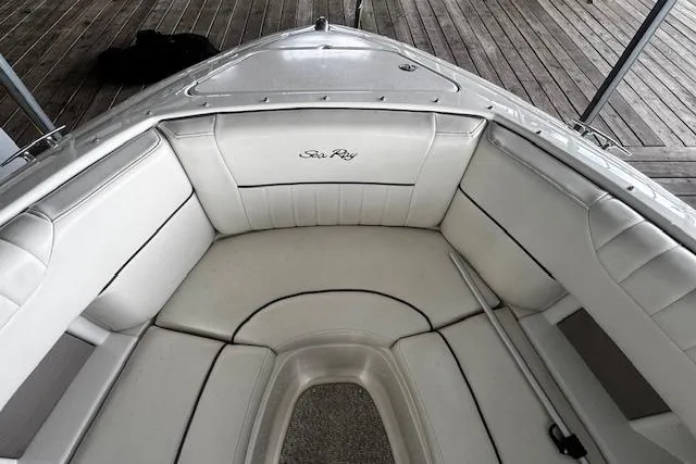 Slide: The Image of 2007 Sea Ray 270 SLX boat interior with white cushioned seating. - 32