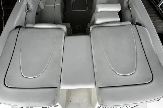 Slide: The Image of 2007 Sea Ray 270 SLX boat interior with white cushioned seating and sleek design. - 36