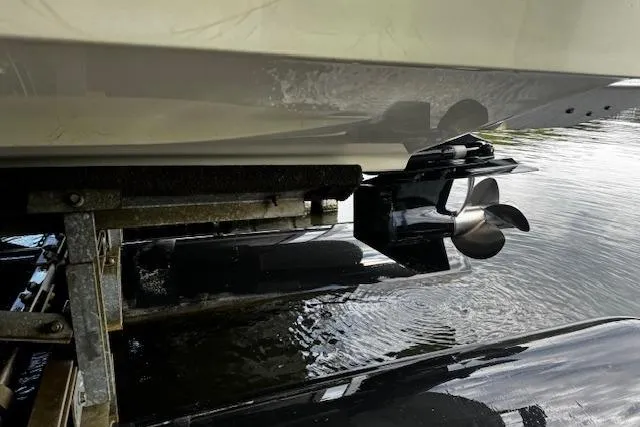 Slide: The Image of 2007 Sea Ray 270 SLX boat propeller and hull above water on lift. - 40