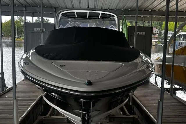 Slide: The Image of 2007 Sea Ray 270 SLX boat docked under a covered marina. - 5