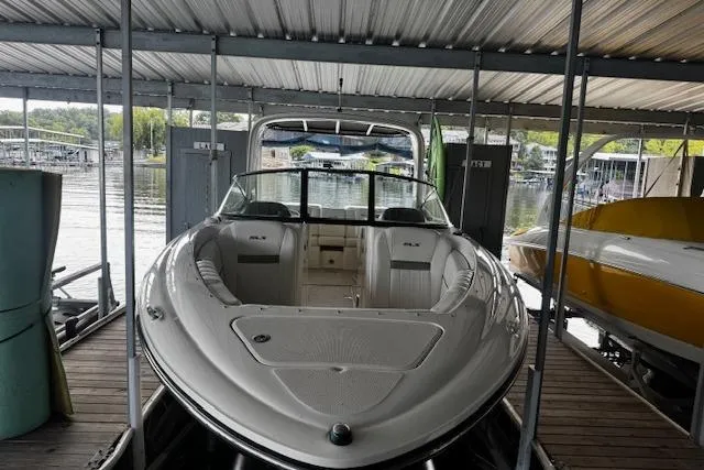 Slide: The Image of 2007 Sea Ray 270 SLX boat docked under a covered marina. - 7