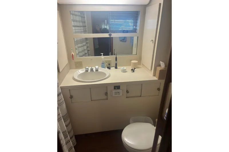 Slide: The Image of Bathroom interior of 1981 Hatteras 56 Motor Yacht with sink and mirror. - 26