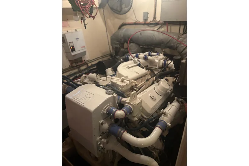 Slide: The Image of Engine room of a 1981 Hatteras 56 Motor Yacht, showcasing mechanical components. - 32