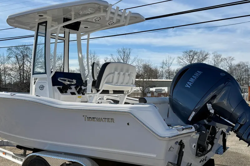 Slide: The Image of 2026 Tidewater 210 CC Adventure boat with Yamaha engine, parked outdoors. - 25