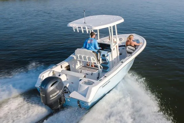 Slide: The Image of 2026 Tidewater 210 CC Adventure boat on trailer, parked near Yamaha dealership. - 3