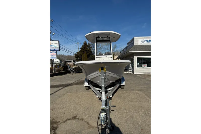 Slide: The Image of 2026 Tidewater 210 CC Adventure boat on trailer, parked outside dealership. - 7