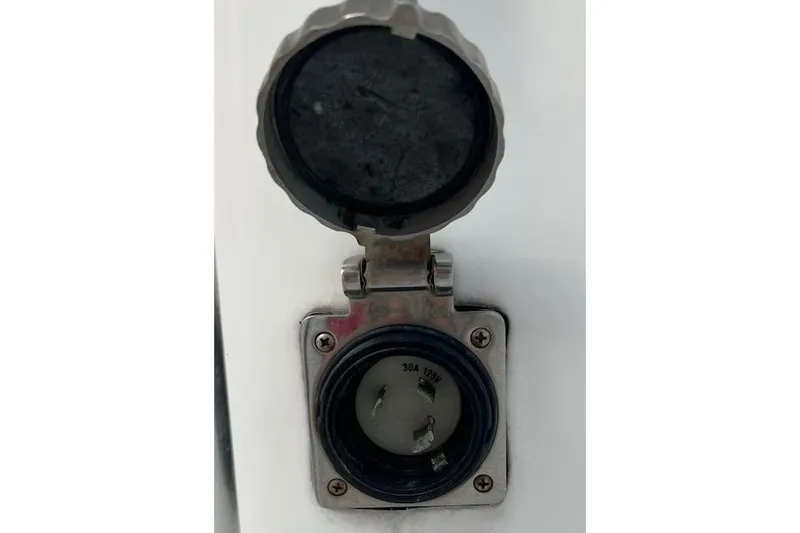 Slide: The Image of 2007 SeaCraft SC32 Master Angler boat docked under clear blue sky. - 32