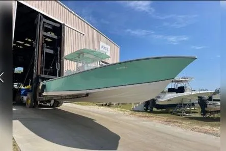 Slide: The Image of 2007 32ft SeaCraft SC32 Master Angler Center Console Boat docked, front view, Bow. - 4