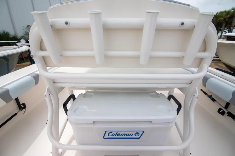 Slide: The Image of 2023 Robalo 246 Cayman boat with Coleman cooler and rod holders. - 13