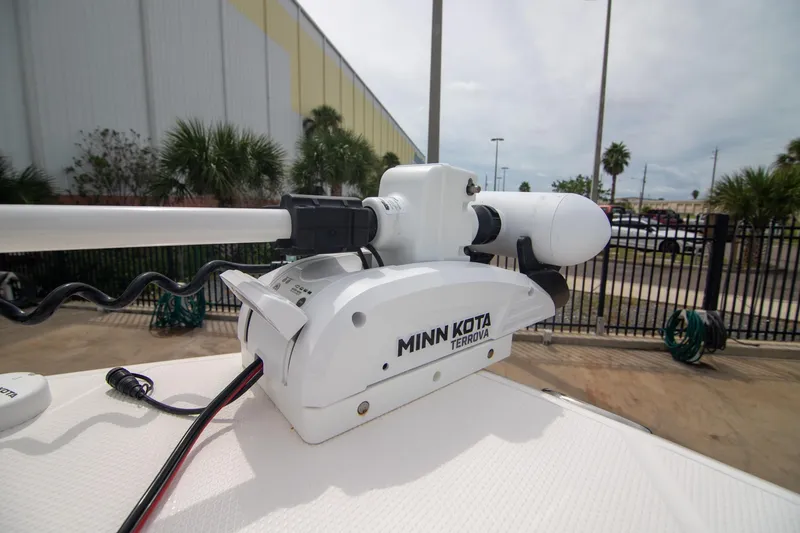 Slide: The Image of Minn Kota Terrova motor on 2023 Robalo 246 Cayman boat, outdoor setting. - 15
