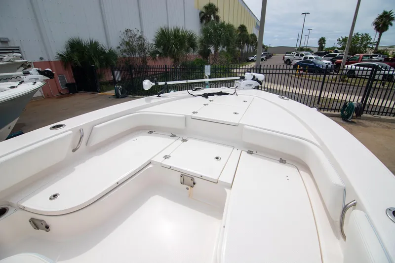 Slide: The Image of 2023 Robalo 246 Cayman boat interior with spacious seating and storage compartments. - 17