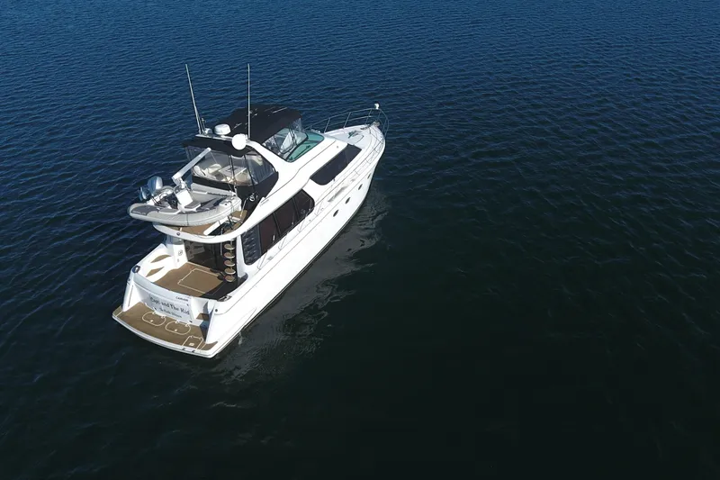 Slide: The Image of Aerial view of 1998 Carver 530 Voyager Pilothouse yacht on open water. - 108