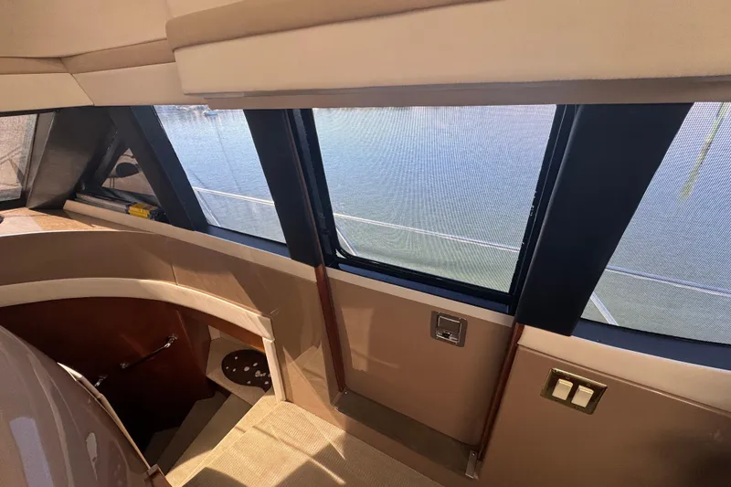 Slide: The Image of Interior view of 1998 Carver 530 Voyager Pilothouse with large windows and elegant design. - 16