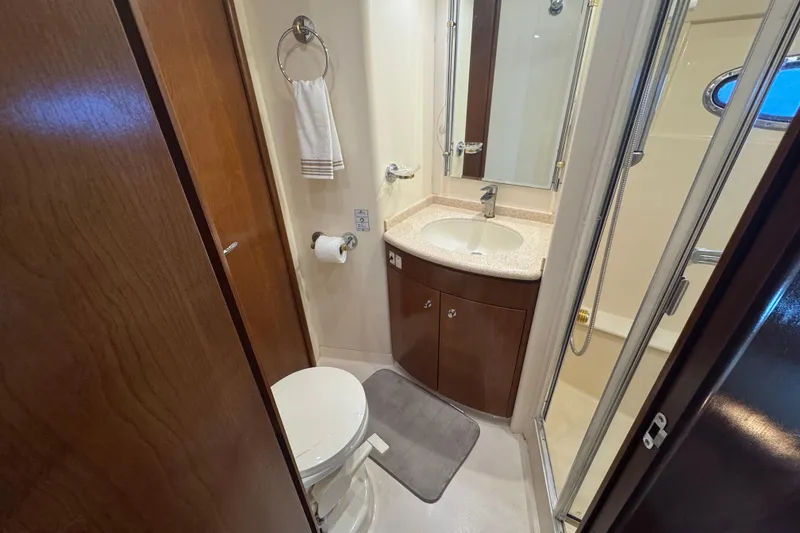 Slide: The Image of Bathroom interior of 1998 Carver 530 Voyager Pilothouse with sink, toilet, and shower. - 25