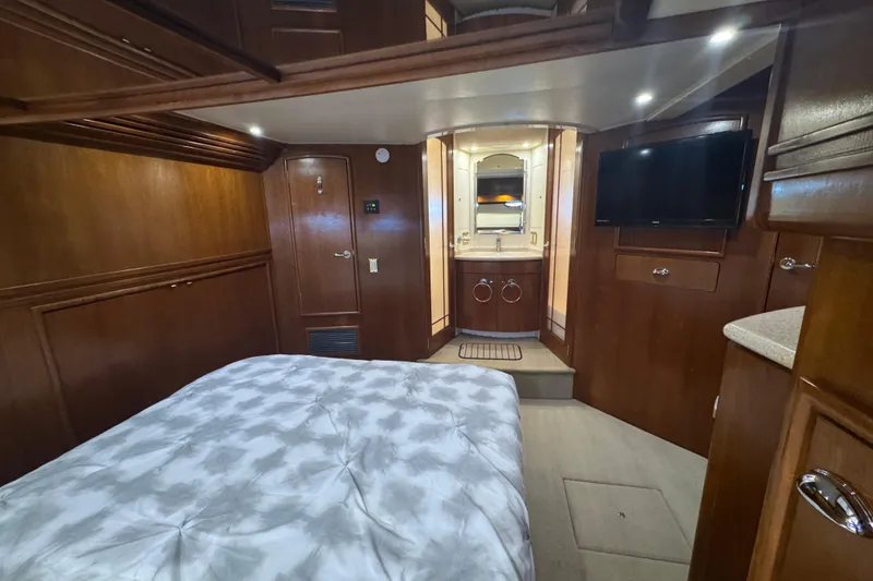 Slide: The Image of Luxurious interior of 1998 Carver 530 Voyager Pilothouse with wood paneling and modern amenities. - 32