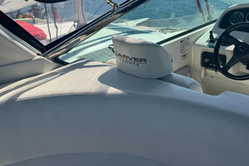 Slide: The Image of 1998 Carver 530 Voyager Pilothouse interior with steering wheel and branded seat. - 46