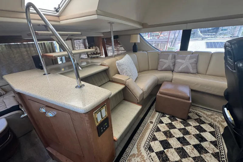 Slide: The Image of Luxurious interior of 1998 Carver 530 Voyager Pilothouse with plush seating and elegant decor. - 56