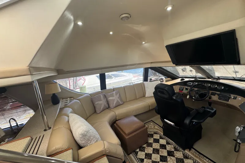 Slide: The Image of Luxurious interior of 1998 Carver 530 Voyager Pilothouse with plush seating and modern helm. - 57