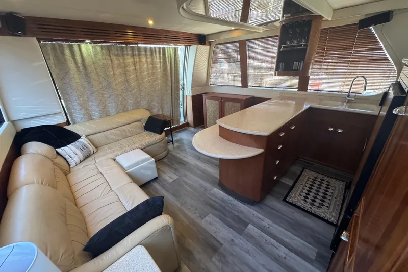 Slide: The Image of Luxurious interior of 1998 Carver 530 Voyager Pilothouse with leather seating and modern kitchen. - 58