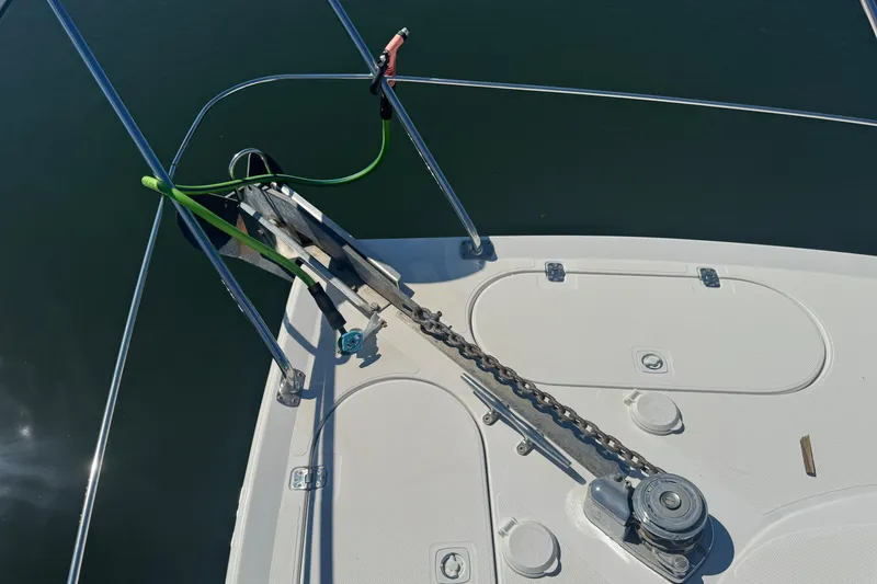Slide: The Image of Bow of 1998 Carver 530 Voyager Pilothouse with anchor and chain mechanism. - 78