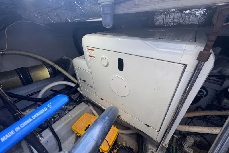 Slide: The Image of Engine room of 1998 Carver 530 Voyager Pilothouse with Kohler power system. - 84