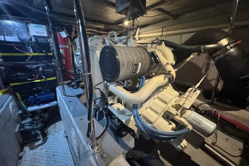 Slide: The Image of Engine room of 1998 Carver 530 Voyager Pilothouse with visible machinery and components. - 89