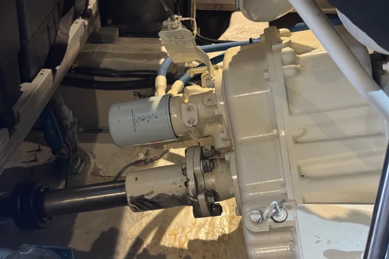 Slide: The Image of Engine compartment of a 1998 Carver 530 Voyager Pilothouse, showcasing mechanical components. - 101