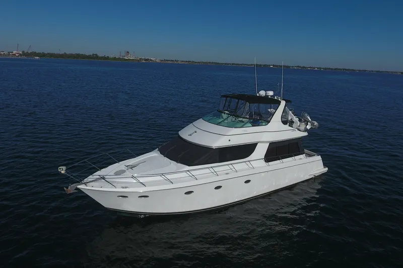 Slide: The Image of 1998 Carver 530 Voyager Pilothouse yacht cruising on open water. - 106
