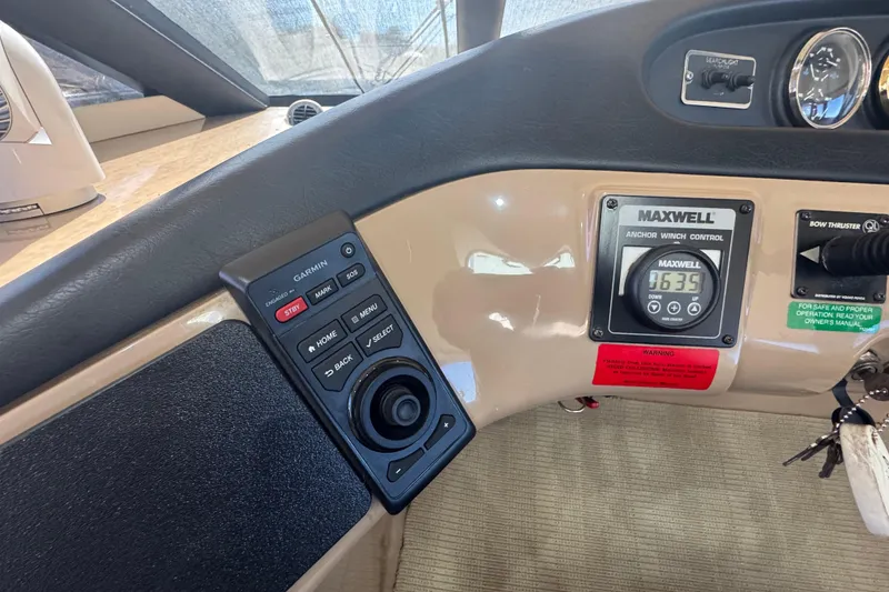 Slide: The Image of Control panel of a 1998 Carver 530 Voyager Pilothouse with Garmin and Maxwell systems. - 12