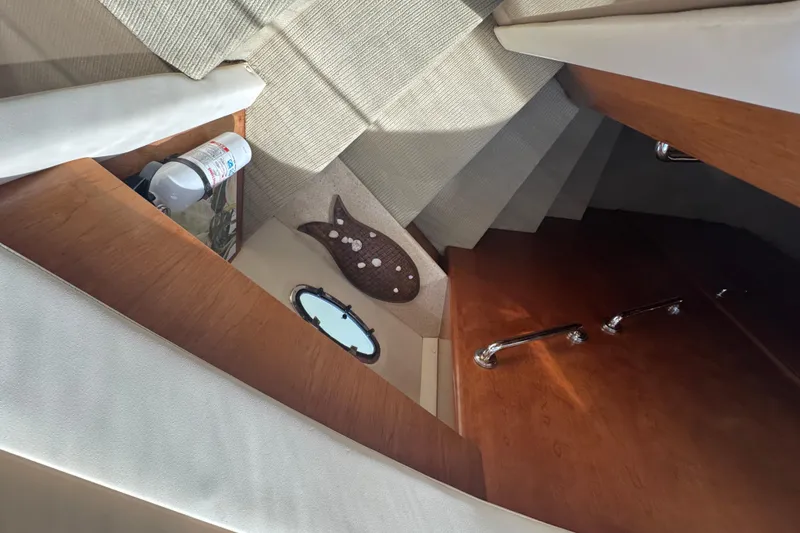 Slide: The Image of Interior of 1998 Carver 530 Voyager Pilothouse with wooden accents and nautical decor. - 17