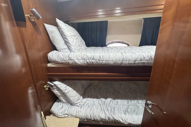 Slide: The Image of Bunk beds in 1998 Carver 530 Voyager Pilothouse cabin with wooden interior. - 22
