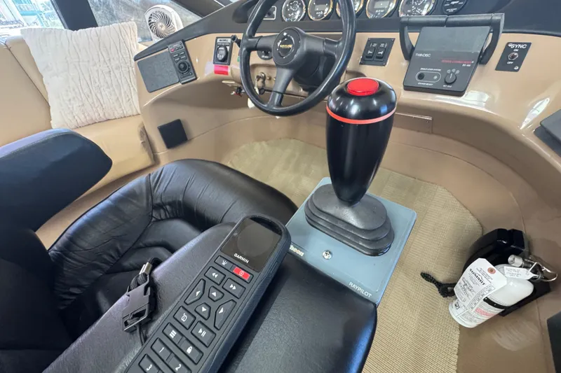 Slide: The Image of 1998 Carver 530 Voyager Pilothouse helm with joystick and control panel. - 35