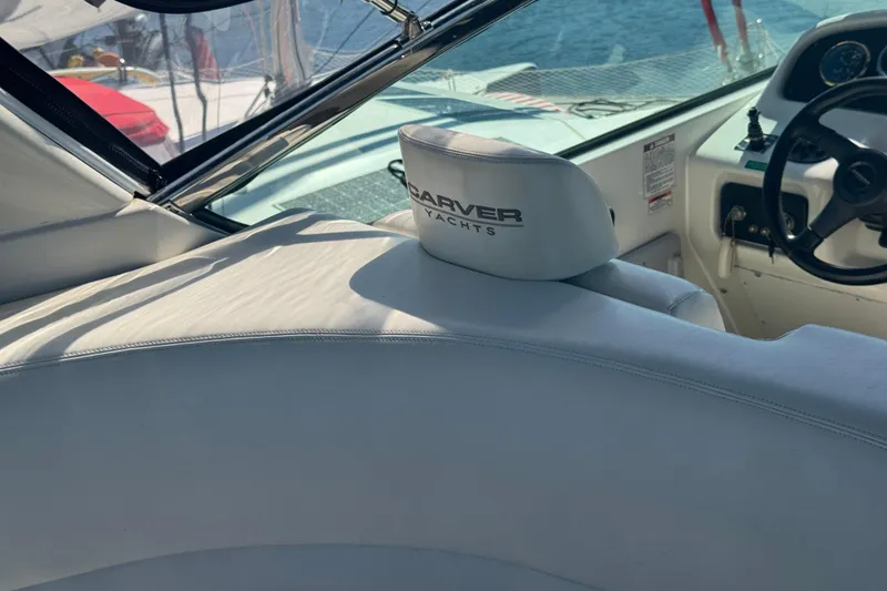 Slide: The Image of Interior of 1998 Carver 530 Voyager Pilothouse yacht with steering wheel and branded seat. - 45