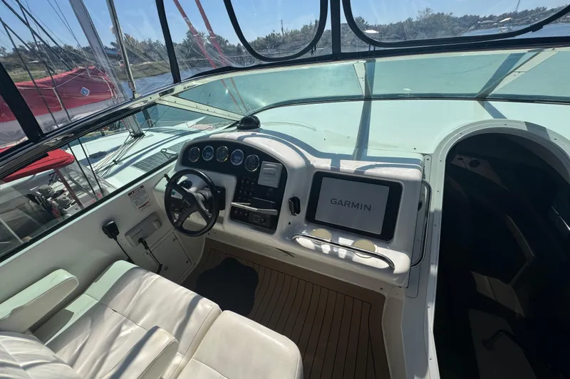 Slide: The Image of 1998 Carver 530 Voyager Pilothouse helm with Garmin navigation system and leather seating. - 47