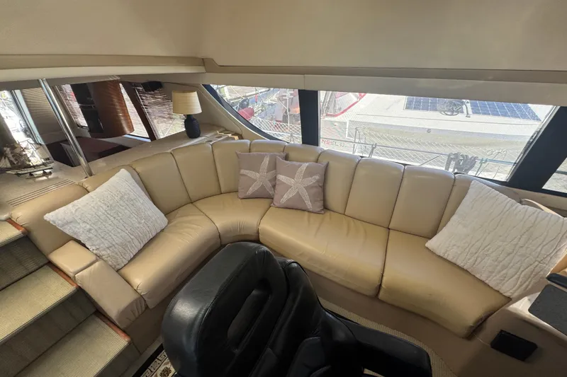 Slide: The Image of Luxurious interior of 1998 Carver 530 Voyager Pilothouse with beige leather seating. - 54