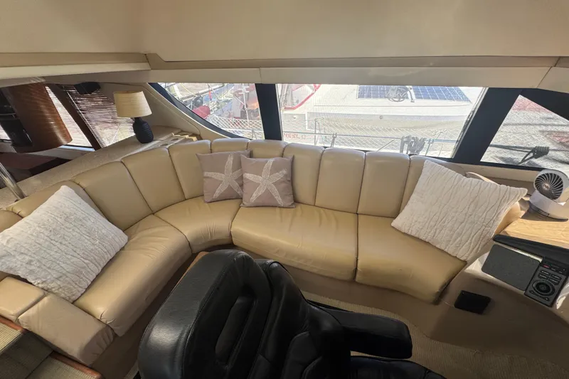 Slide: The Image of Luxurious interior of 1998 Carver 530 Voyager Pilothouse with beige leather seating. - 55