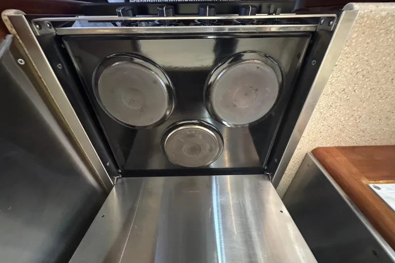 Slide: The Image of Stainless steel stove in 1998 Carver 530 Voyager Pilothouse yacht kitchen. - 65