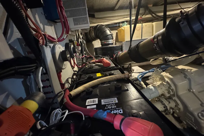 Slide: The Image of Engine room of 1998 Carver 530 Voyager Pilothouse with wiring and components. - 92