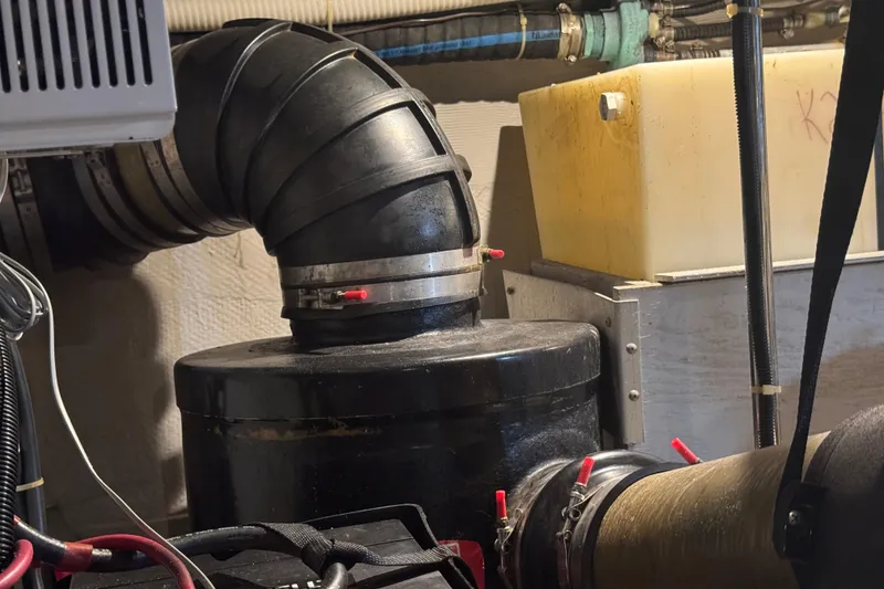 Slide: The Image of Engine room of 1998 Carver 530 Voyager Pilothouse with pipes and machinery. - 93