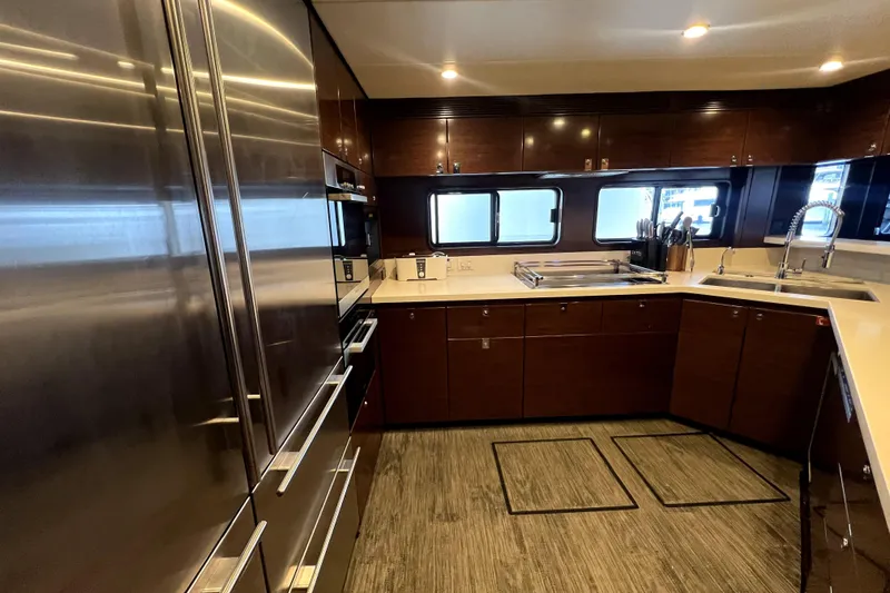Slide: The Image of Luxurious kitchen interior of 2009 Nordhavn N78 yacht with modern appliances and sleek cabinetry. - 20