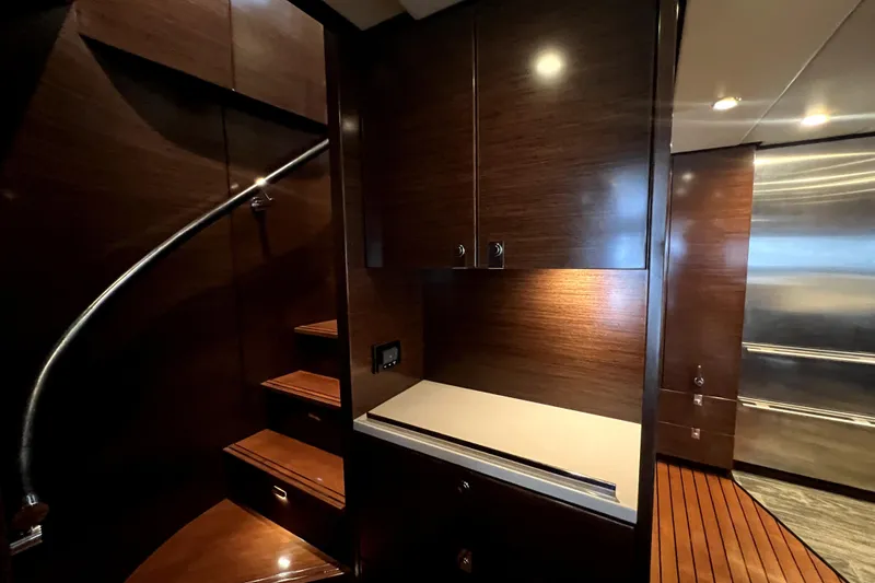 Slide: The Image of Luxurious interior of 2009 Nordhavn N78 yacht with wooden cabinetry and staircase. - 22