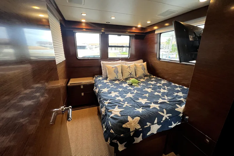 Slide: The Image of Luxurious cabin interior of 2009 Nordhavn N78 yacht with starfish-themed bedding. - 25