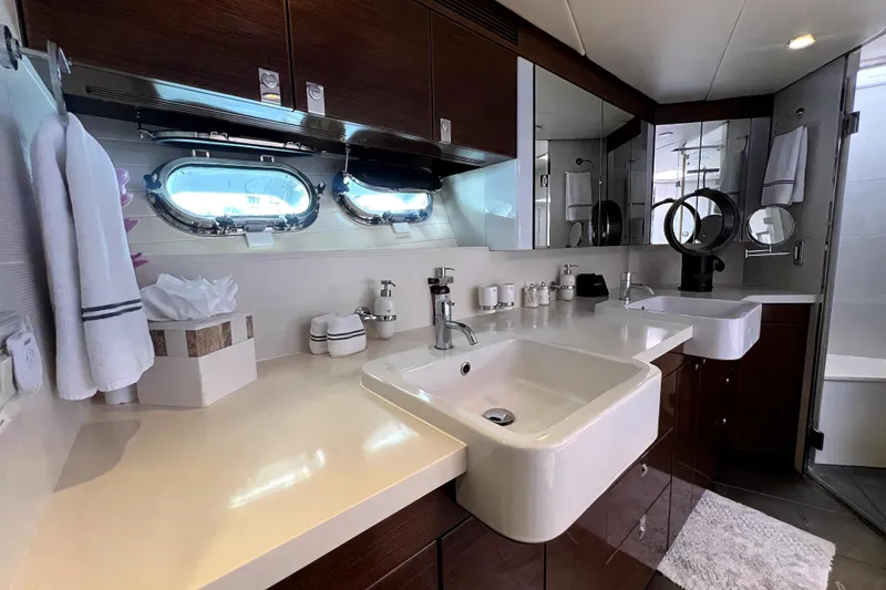 Slide: The Image of Luxurious bathroom interior of 2009 Nordhavn N78 yacht with modern fixtures and porthole windows. - 35