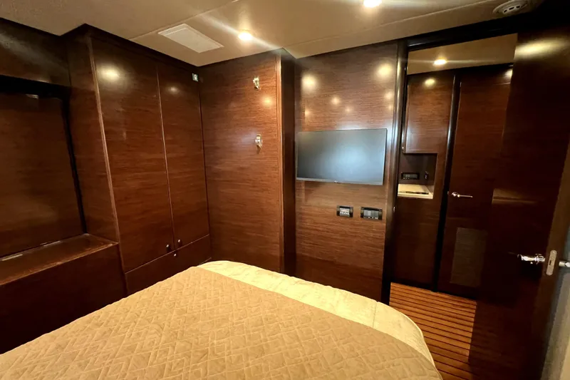 Slide: The Image of Luxurious cabin interior of 2009 Nordhavn N78 yacht with wood paneling and modern amenities. - 38