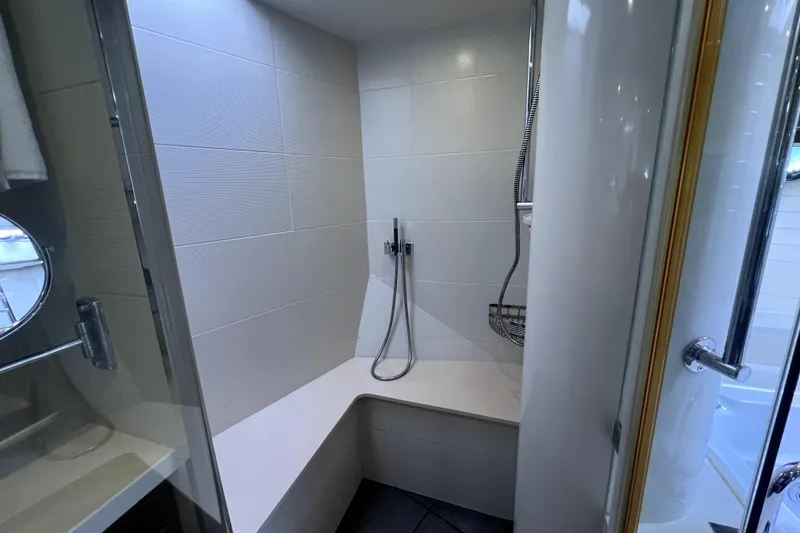 Slide: The Image of Luxurious shower area in 2009 Nordhavn N78 yacht with modern fixtures and seating. - 40