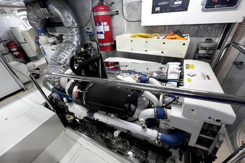 Slide: The Image of Engine room of a 2009 Nordhavn N78 yacht, featuring advanced machinery and safety equipment. - 44