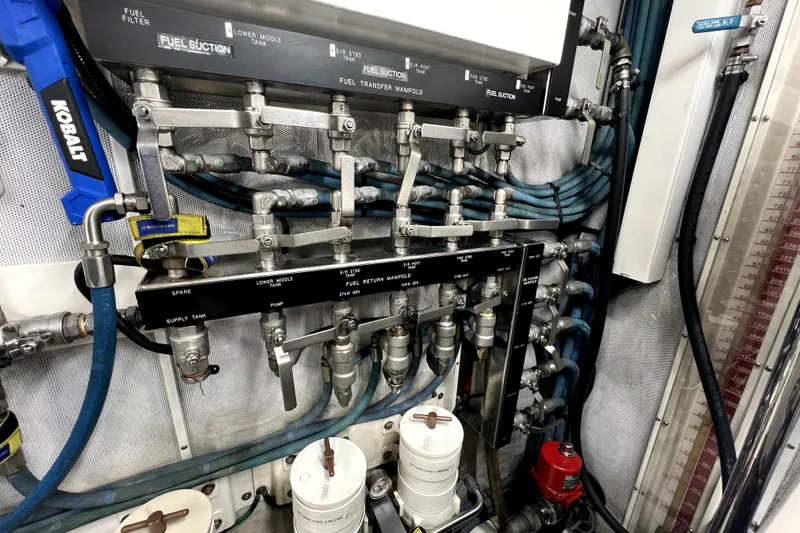 Slide: The Image of Engine room of 2009 Nordhavn N78 yacht, showcasing fuel system and manifold components. - 45