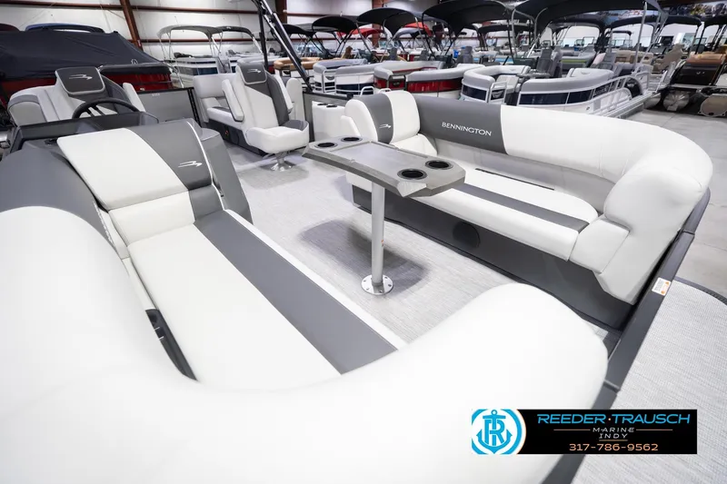 Slide: The Image of 2026 Bennington 20 SSR pontoon boat interior with plush seating and cup holders. - 13